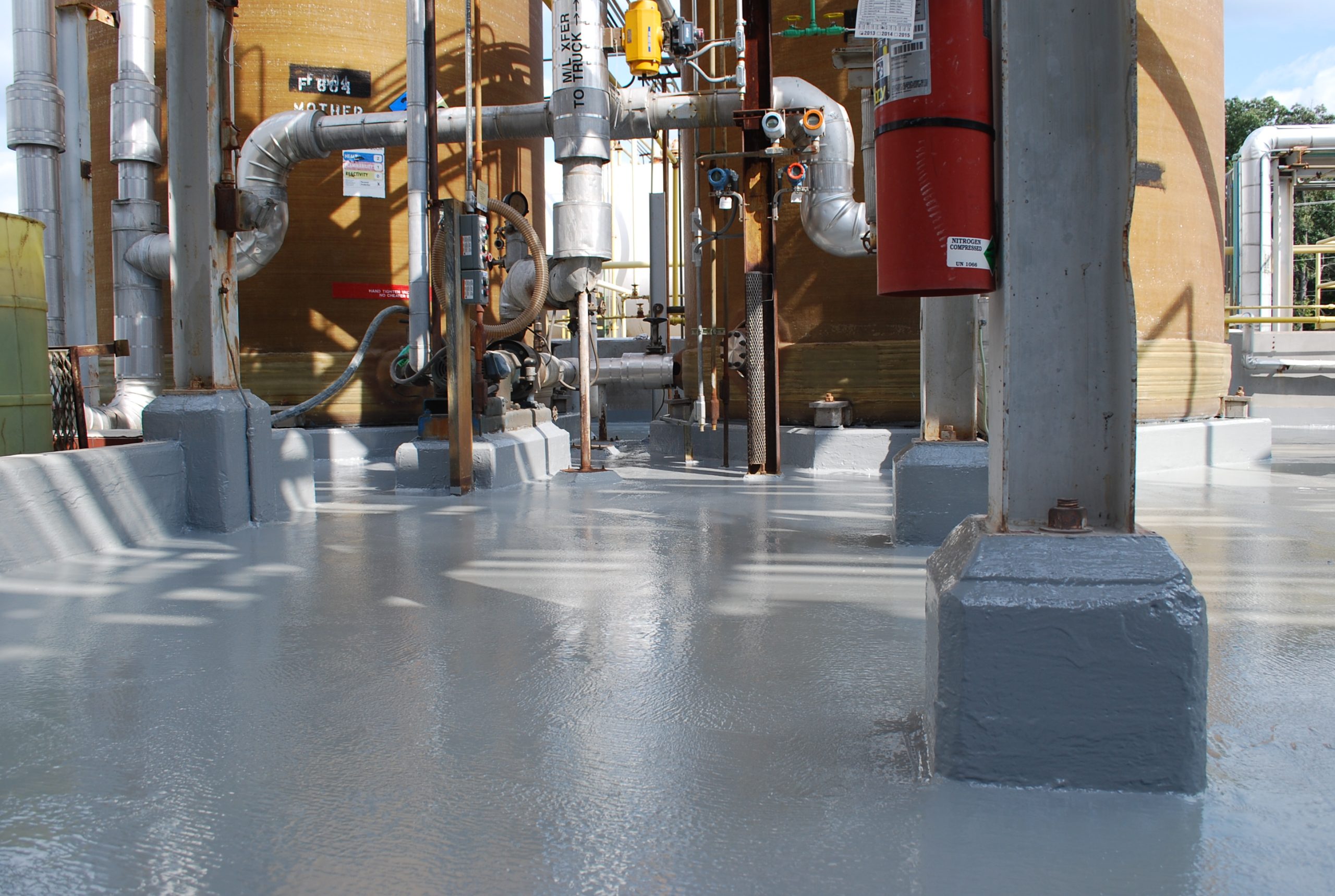 Chemical Containment Resinous Floor Coating for Industrial Applications Industrial Resinous Floor Coating Installed in Cementitious Urethane System