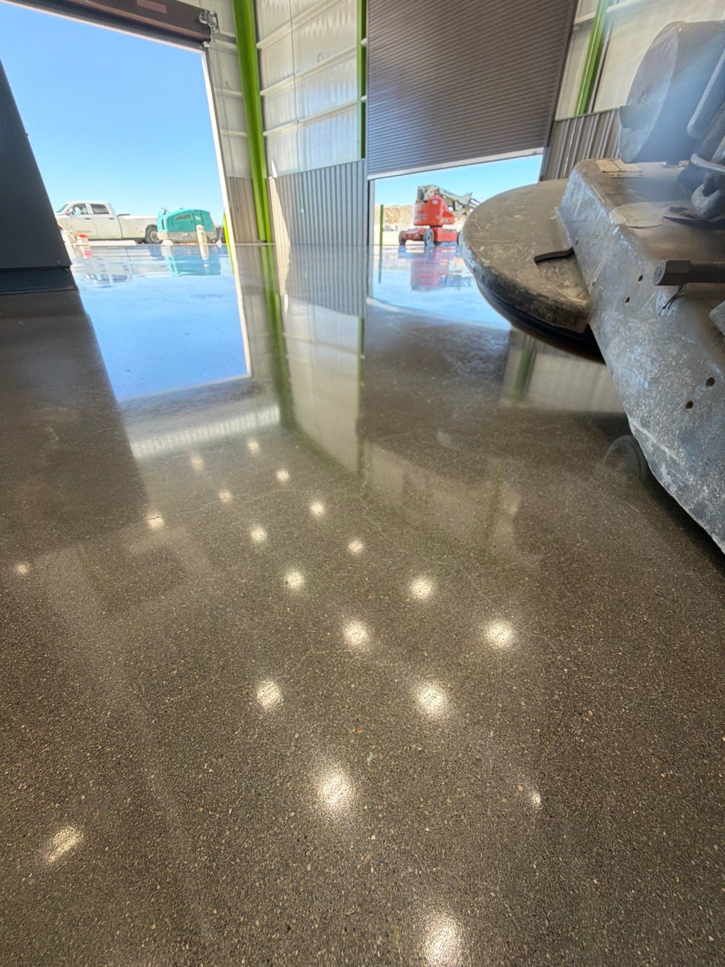 Polished Concrete Maintenance Floor – High-Gloss Finish | Greenville, SC High-gloss polished concrete floor in an industrial maintenance facility in Greenville, SC